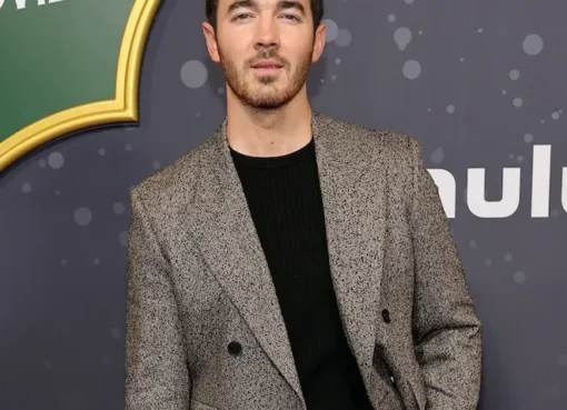 Kevin Jonas flexing his newly muscular physique in a gym video, shirtless and looking strong.