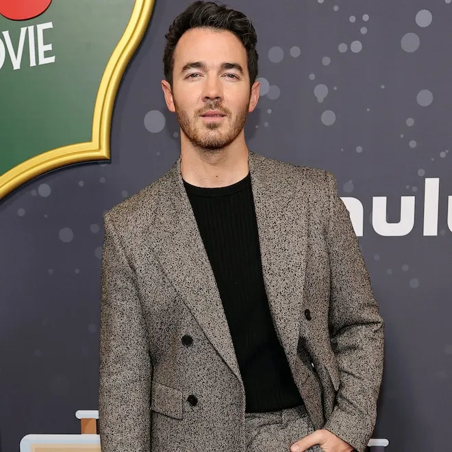Kevin Jonas flexing his newly muscular physique in a gym video, shirtless and looking strong.