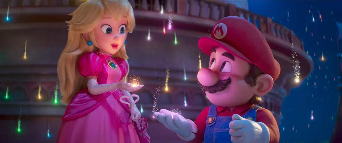 Mario jumping through a colorful galaxy, with stars and planets in the background.