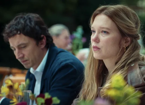 Léa Seydoux looking intense, possibly singing, in a scene from 'Gentle Monster' with a soft, artistic filter.