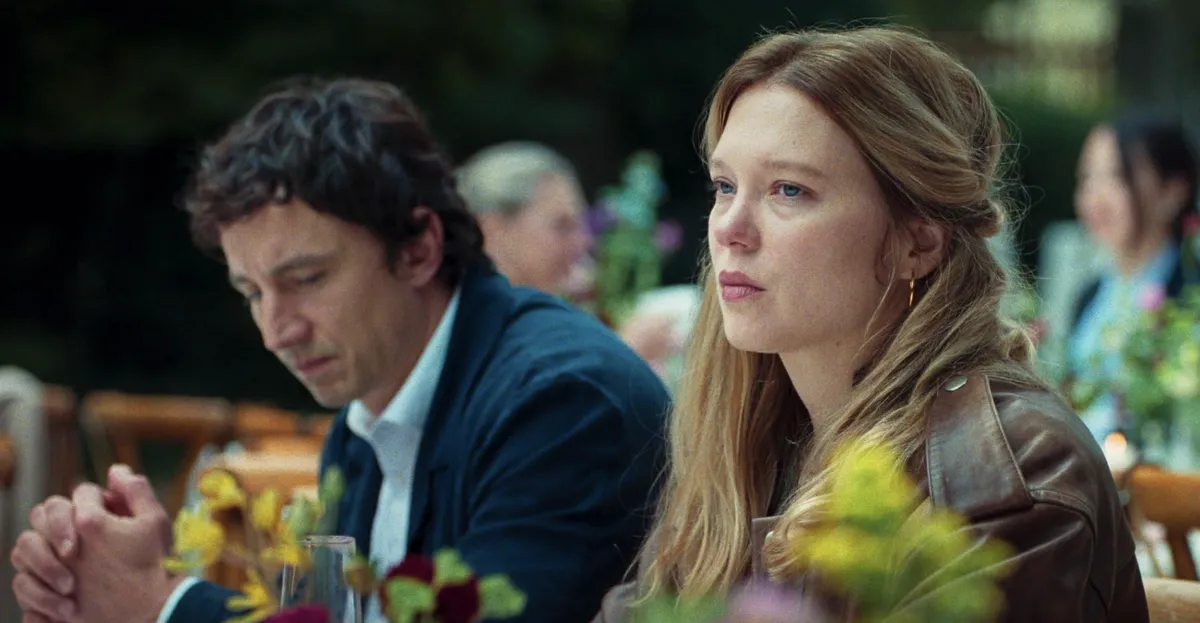 Léa Seydoux looking intense, possibly singing, in a scene from 'Gentle Monster' with a soft, artistic filter.