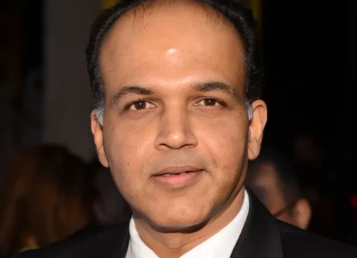 Ashutosh Gowariker smiling at an event.
