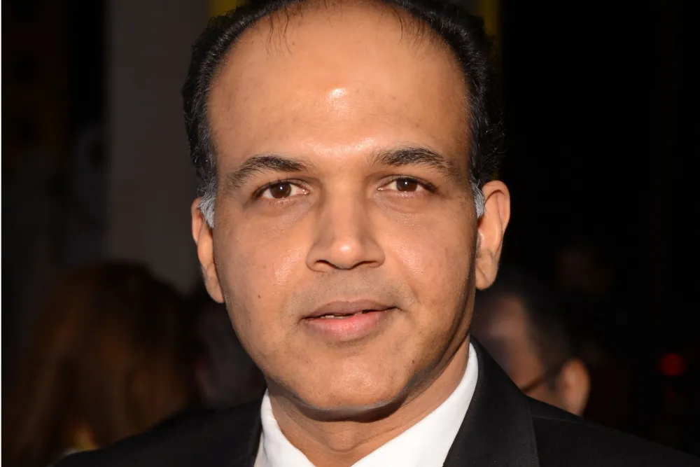 Ashutosh Gowariker smiling at an event.