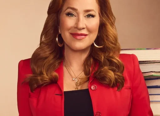 Photo of Lisa Ann Walter smiling.