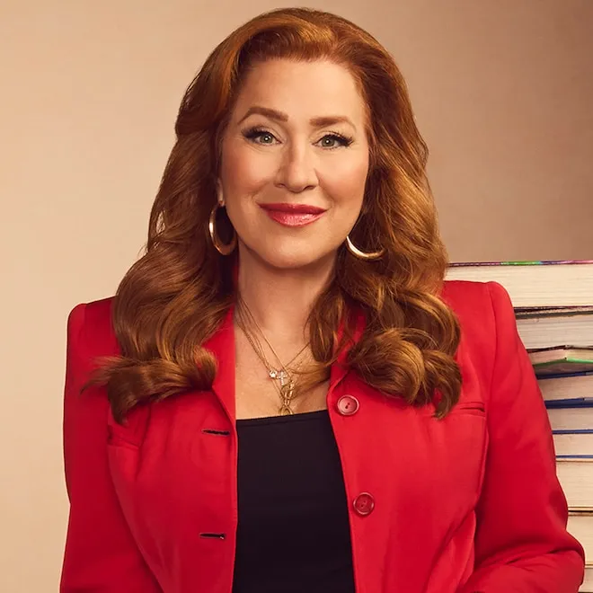 Photo of Lisa Ann Walter smiling.