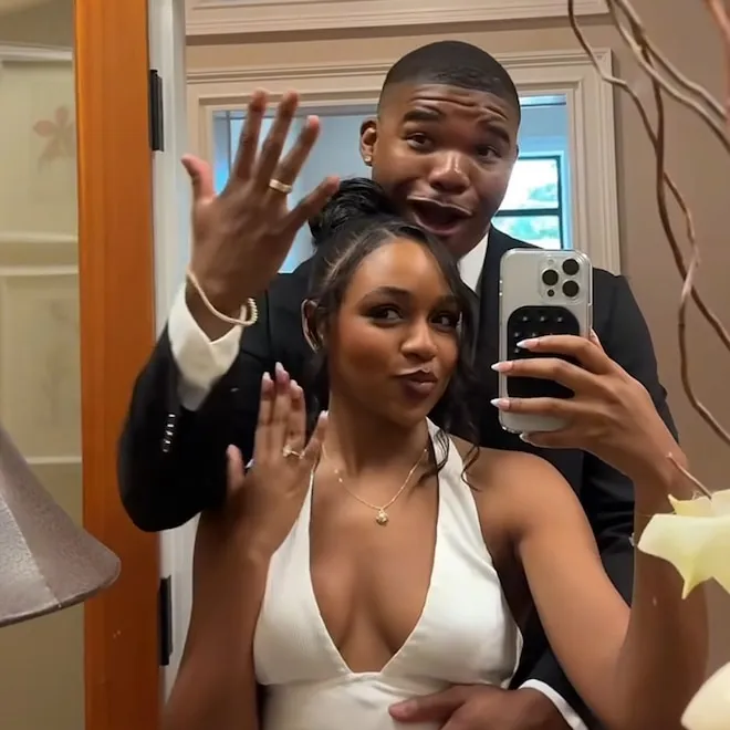 Jalen Brown and Joiya Lanae smiling at their wedding.