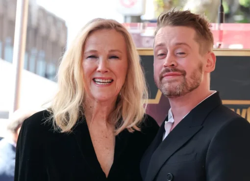 Macaulay Culkin and Catherine O'Hara smiling together in a promotional photo.
