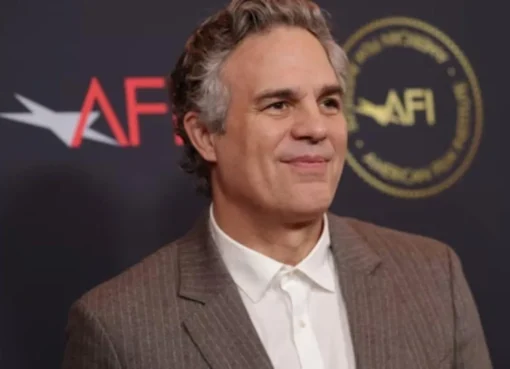 Mark Ruffalo looking serious while speaking at a microphone