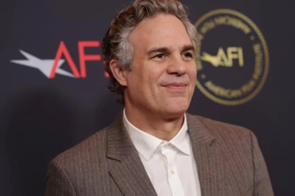 Mark Ruffalo looking serious while speaking at a microphone