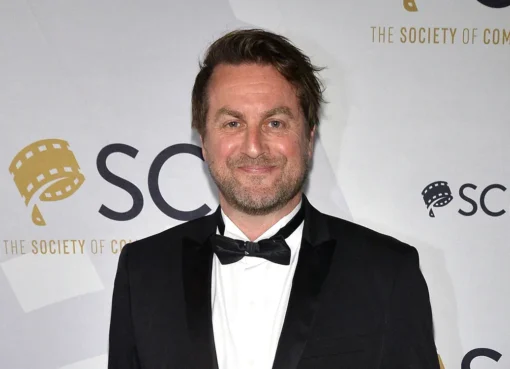 A close-up photo of composer Mark Smythe smiling gently.