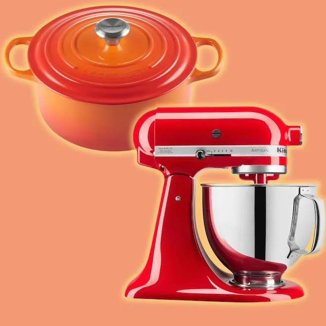 A colorful KitchenAid stand mixer next to a red Le Creuset Dutch oven.
