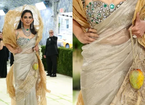 Isha Ambani on the Met Gala red carpet holding a mango-shaped accessory.