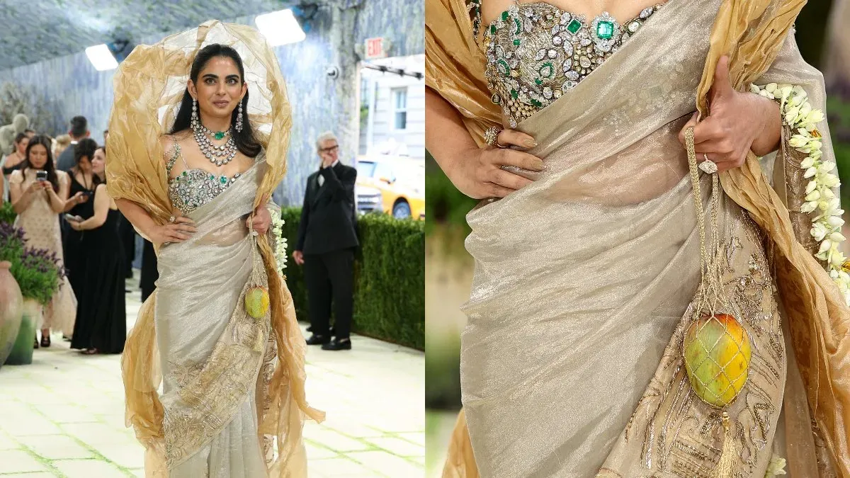 Isha Ambani on the Met Gala red carpet holding a mango-shaped accessory.