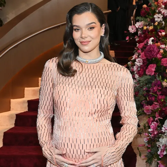 Hailee Steinfeld and Josh Allen smiling, perhaps with a soft glow, hinting at new parenthood.