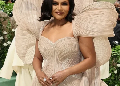 Mindy Kaling smiling warmly and genuinely, looking healthy and happy.