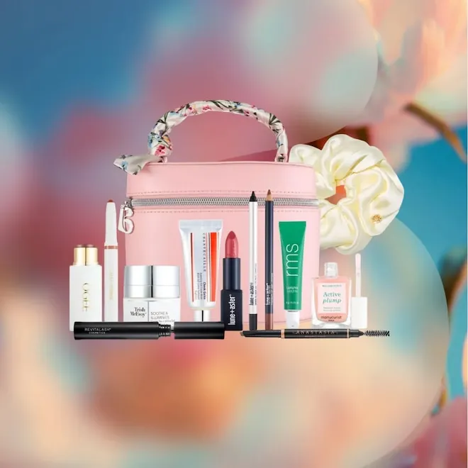 A collection of luxury beauty products from the Bluemercury Spring Makeup Edit neatly arranged on a clean white background.