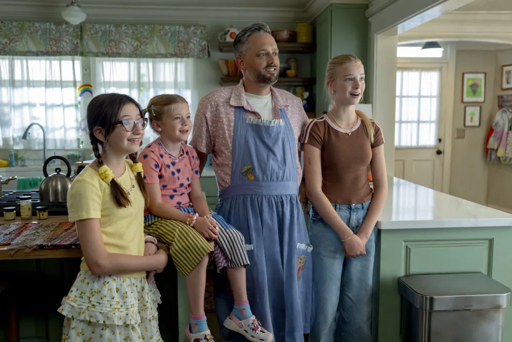 Nate Bargatze looking confused in a movie scene.