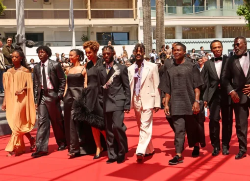 A film premiere audience giving a standing ovation.