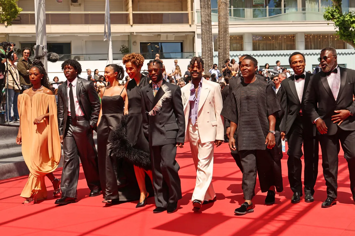 A film premiere audience giving a standing ovation.