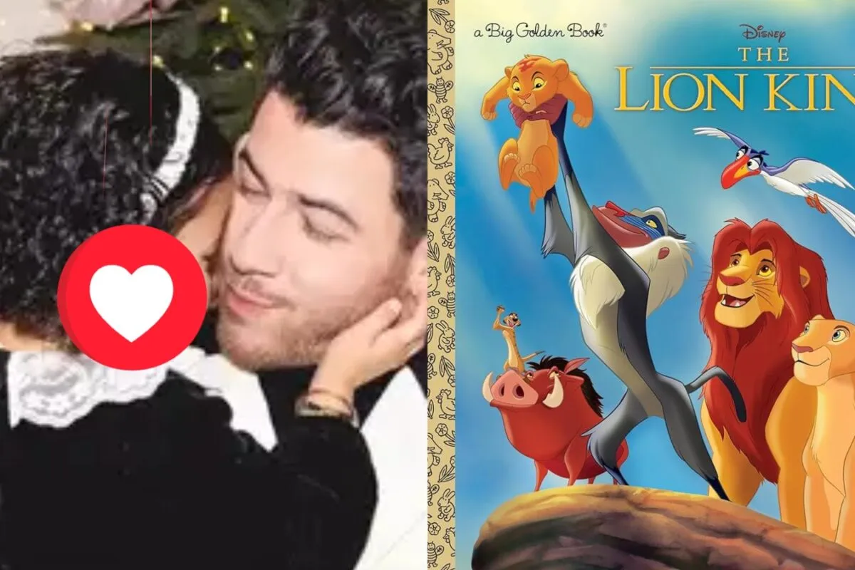 Nick Jonas smiling while holding his daughter Malti