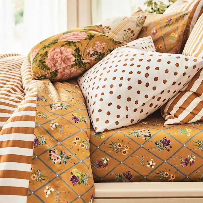 A collection of stylish Anthropologie home decor items on sale.