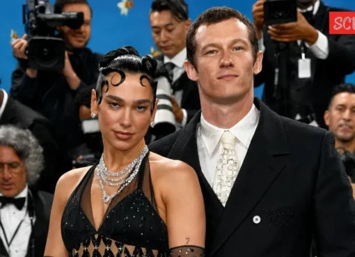 Dua Lipa and Callum Turner smiling.