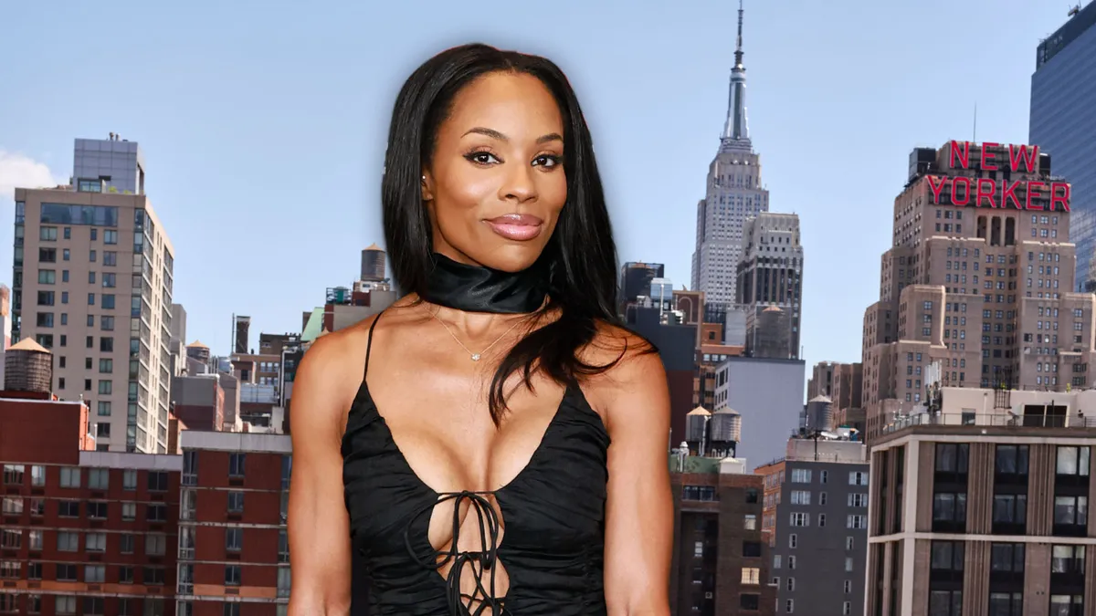 Photo of Devyn Simone smiling.