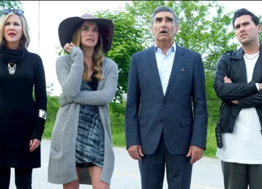 The Rose family posing dramatically in front of their motel.