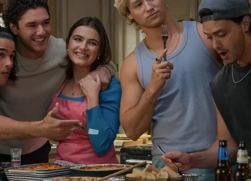 A candid photo of Hannah Wells (Ella Bright) and Garrett Graham (Belmont Cameli) smiling and looking cozy on a college campus.