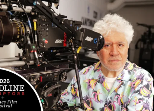 Director Pedro Almodóvar smiling during an interview.