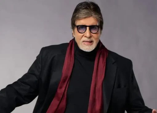 Amitabh Bachchan smiling at an event.