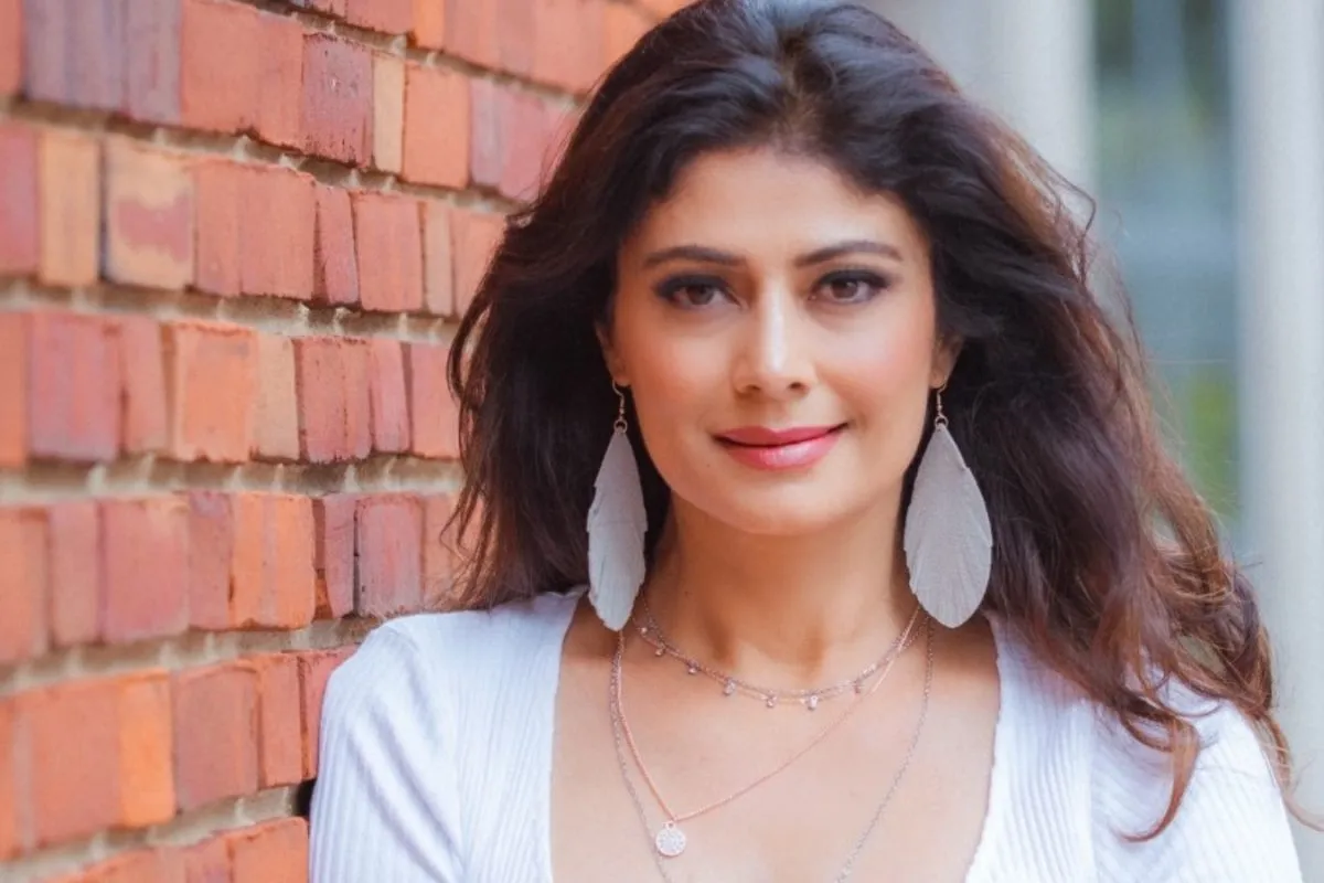 Pooja Batra smiling and looking elegant in a close-up shot.