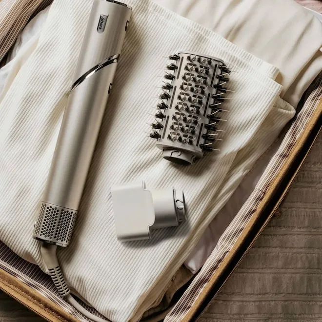A selection of popular hair styling tools like the Dyson Airwrap and Shark FlexStyle.
