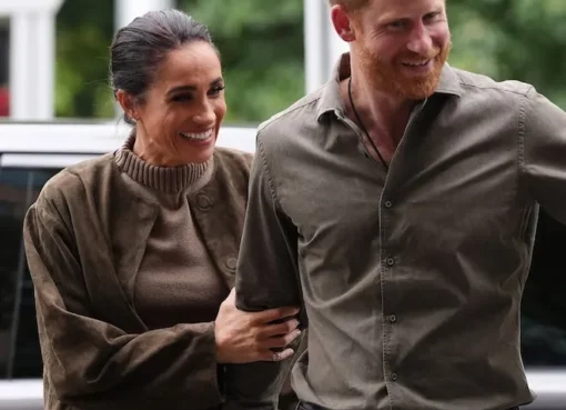 Princess Lilibet smiling with bright red hair just like her father Prince Harry