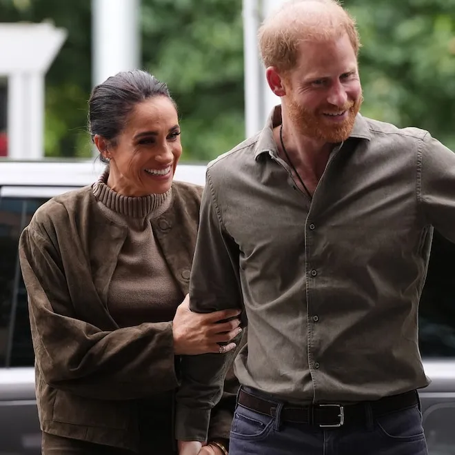 Princess Lilibet smiling with bright red hair just like her father Prince Harry