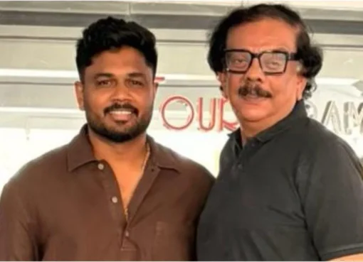 Priyadarshan and Sanju Samson smiling together for a photo.