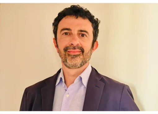Lorenzo Gangarossa, an Italian film producer, smiling thoughtfully.