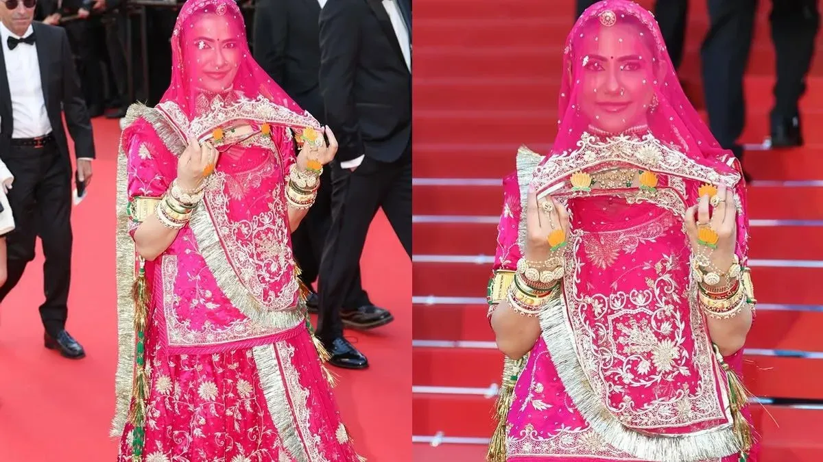 Ruchi Gujjar posing on the red carpet in a pink ghunghat.