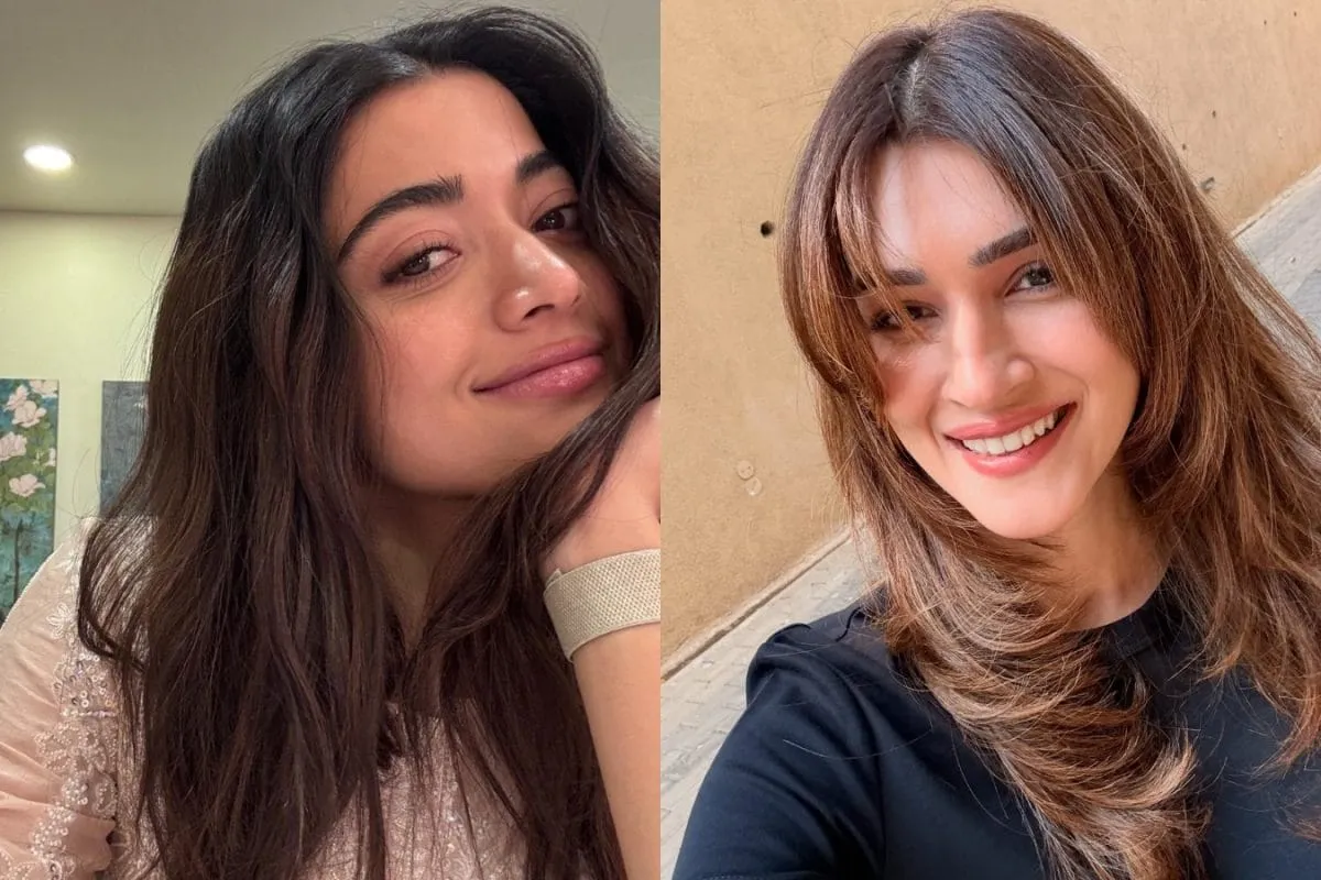 Rashmika Mandanna and Kriti Sanon laughing at a Bollywood event