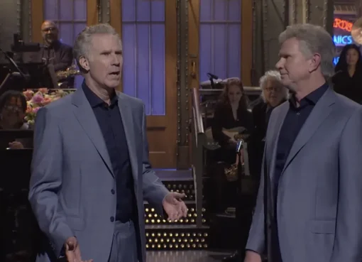 Chad Smith and Will Ferrell standing together looking like identical twins on the Saturday Night Live stage.