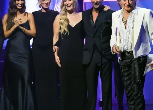 Rod Stewart smiling with his signature spiky hair style