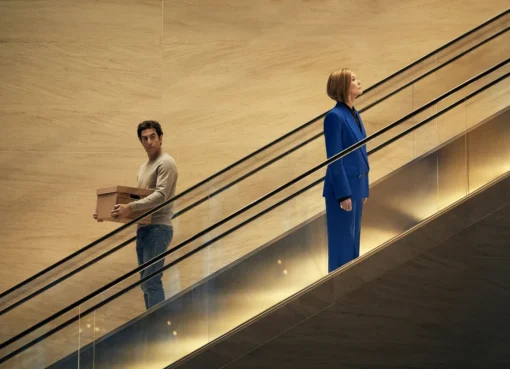 Sacha Baron Cohen and Rosamund Pike in a movie scene.