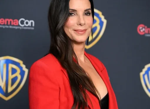 Sandra Bullock smiling with her two children.