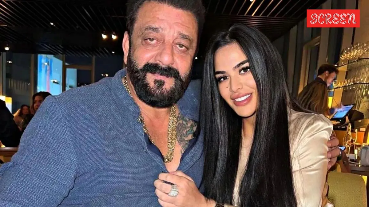 A warm, candid photo of Trishala Dutt and Sanjay Dutt sharing a laugh, symbolizing their close father-daughter bond.