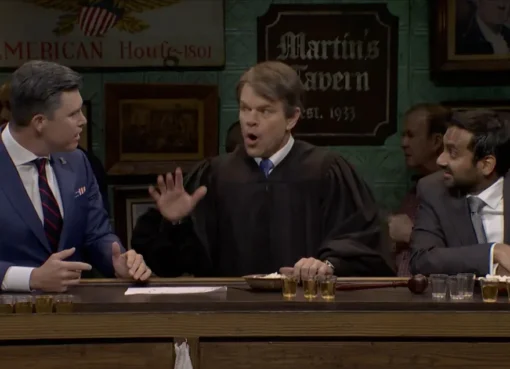 Matt Damon dressed as Brett Kavanaugh, Colin Jost as Pete Hegseth, and Aziz Ansari as Kash Patel in a bar setting.