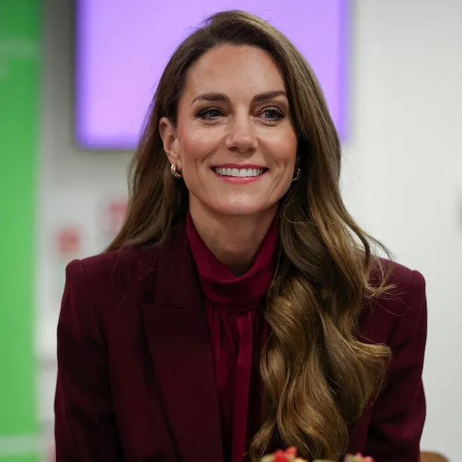 Kate Middleton on an overseas trip in Italy, smiling and greeting people.