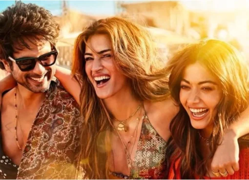 Shahid Kapoor, Kriti Sanon, and Rashmika Mandanna smiling together at an event.