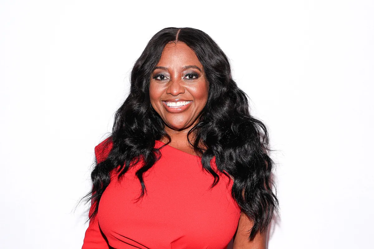 Sherri Shepherd smiling on her talk show set.