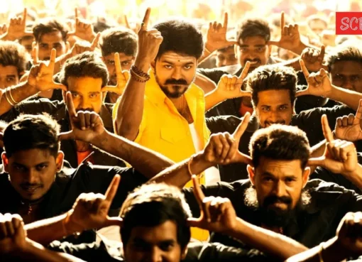 Crowds cheering excitedly at a movie theater, celebrating Vijay's election win.