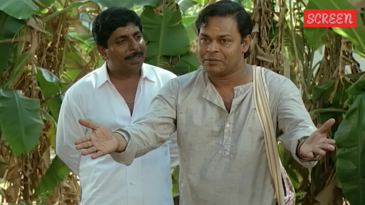 Sreenivasan and Innocent laughing together on a film set.